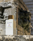 Lifestyle shot of Eau d'Italie Eau de Parfum Spray (100 ml) with stone fountain in the background