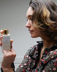 Close up of model holding Eau d'Italie Easy to Love Eau de Parfum Spray bottle (100 ml)