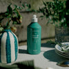Kerzon Dishwashing Liquid - Fleurs de Romarin (500 ml) - product shown on table. 