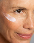 Close up of Odacite Creme de la Nuit applied to woman's face with mature skin