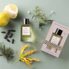 Essential Parfums Nice Bergamote Perfume by Antoine Maisondieu with note ingredients scattered - beauty shot