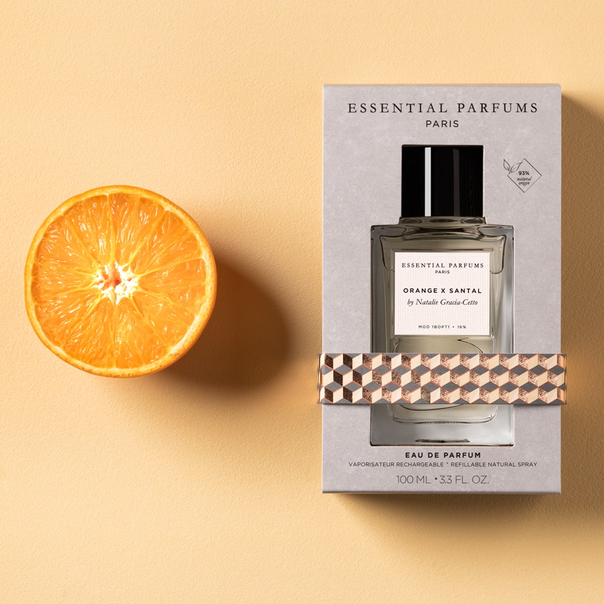 Essential Parfums Orange X Santal Perfume by Natalie Gracia Cetto - Refillable - product shown next to orange.