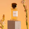 BDK Parfums Tubereuse Imperiale Eau de Parfum (100 ml) beauty shot with bottle on pedestal and tubereuse flowers in the background