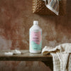 Kerzon Laundry Soap - Petit Grain (1 L) - product shown on bench. 