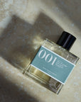 Bon Parfumeur Paris 001 Orange Blossom Petitgrain Bergamot - bottle on stone floor with long shadow