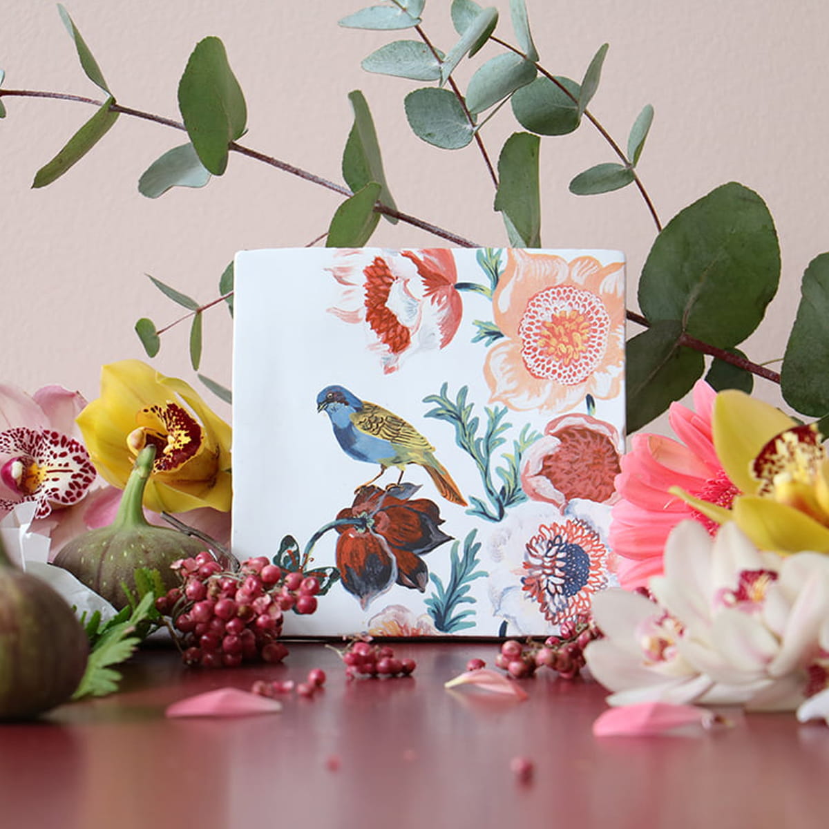 Storytiles Small Tile – Nathalie Lete Feeling Floral (1 pc) - product shown surrounded by leaves and flowers. 