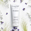 Leonor Greyl Bain Traitant A La Propolis – Gentle Dandruff Treatment Shampoo 200 ml with purple flowers on a white background