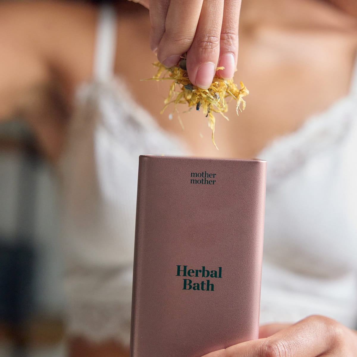 Mother Mother Organic Herbal Bath (10 oz) - product shown being taken out of packaging. 