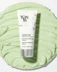 Top view of Yon-Ka Paris Sensitive Creme Anti-Redness (50 ml) with large smear of product in the background to show green color and texture