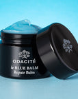 Odacite Le Blue Balm (50 ml) showing balm in container with lid to the side