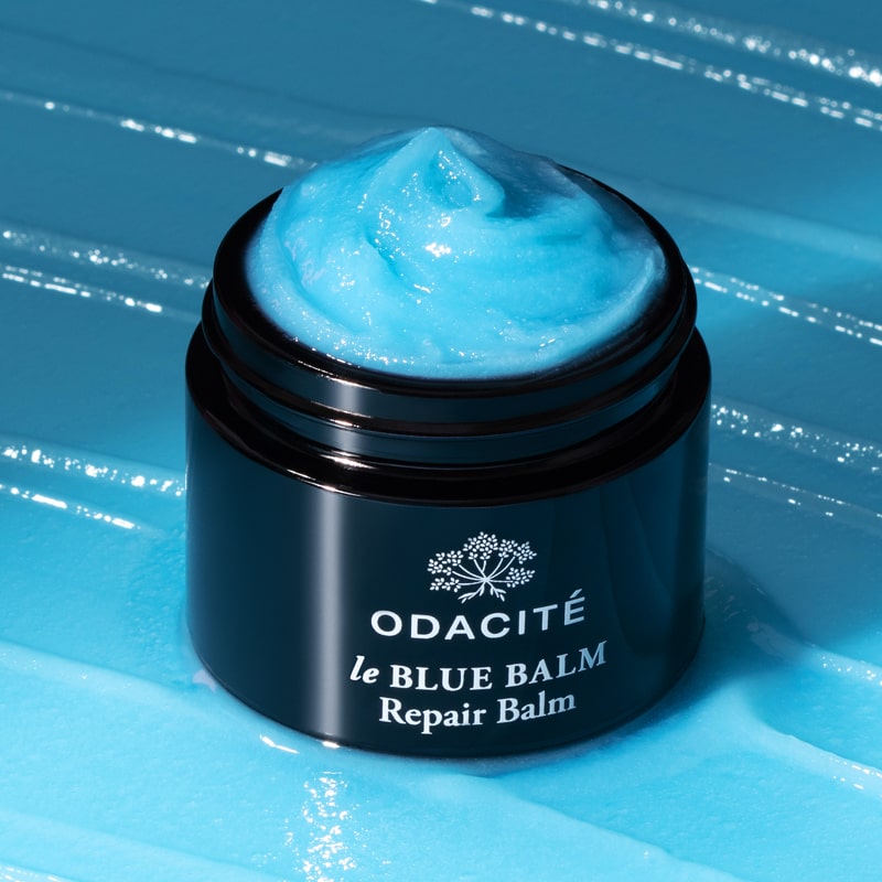 Odacite Le Blue Balm (50 ml) showing balm in container with balm in the background