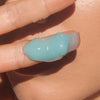 Odacite Le Blue Balm showing finger with balm 