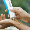 Activist Manuka Honey Mask (80 ml) - model shown squeezing product onto wrist