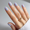 Close up of model wearing Kure Bazaar Nail Laquer ‚Äì Papillon