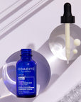 Lifestyle shot of Odacite Retinol + Hyaluronic Acid Renewing Serum showing bottle and dropper  side by side