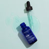 Odacite Salicylic + Hyaluronic Acid Clarifying Serum with dropper and serum in the background