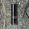 Lifestyle shot of de Mamiel Gravity Fix (30 ml) shown top view on textured background