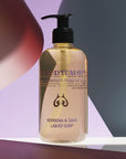 Lifestyle shot of Eau d'Italie Verbena & Sage Liquid Soap (300 ml) with purple and dark gray paper in the background