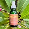 Neil Naturopathic Elixir Oil Pre-Wash Treatment - product shown on top of plant