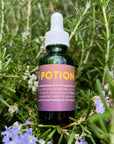 Neil Naturopathic Potion Oil Finishing Treatment  -  Potion bottle shown sitting on rosemary plant
