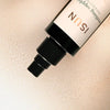 Close up of ISUN Soothing Sapphire Face & Body Mist (50 ml) showing product swatch