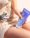 Model applying Yon-Ka Paris Lait Hydratant Detox – Lavender on thigh