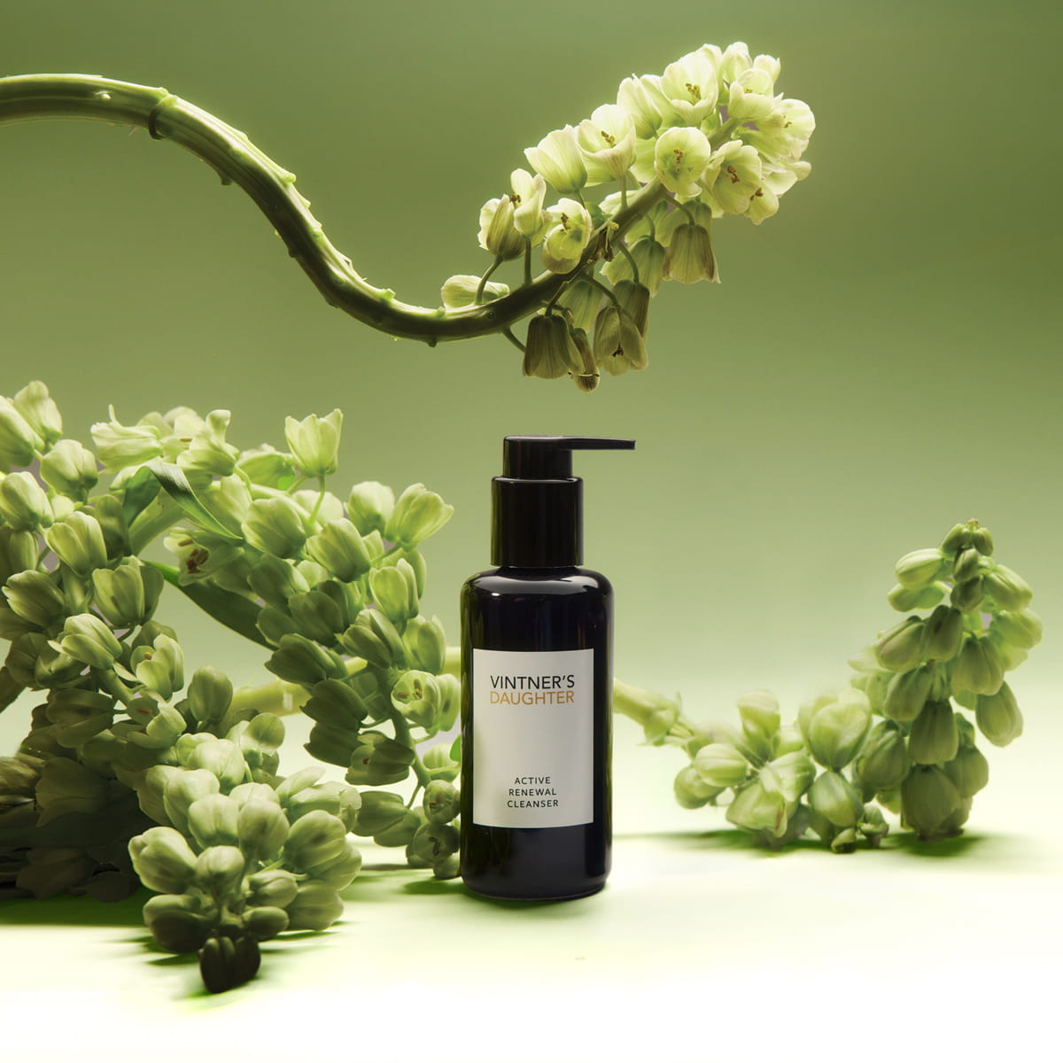 Vintner's Daughter Active Renewal Cleanser (115 ml) - product shown with flowers. 