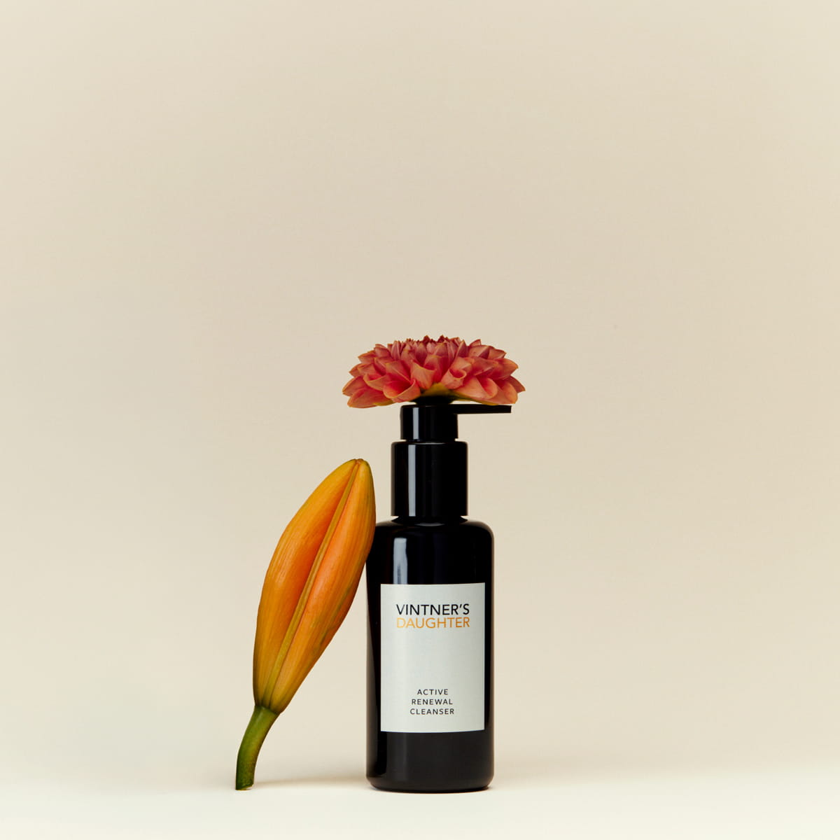 Vintner's Daughter Active Renewal Cleanser (115 ml) - product shown with flowers.