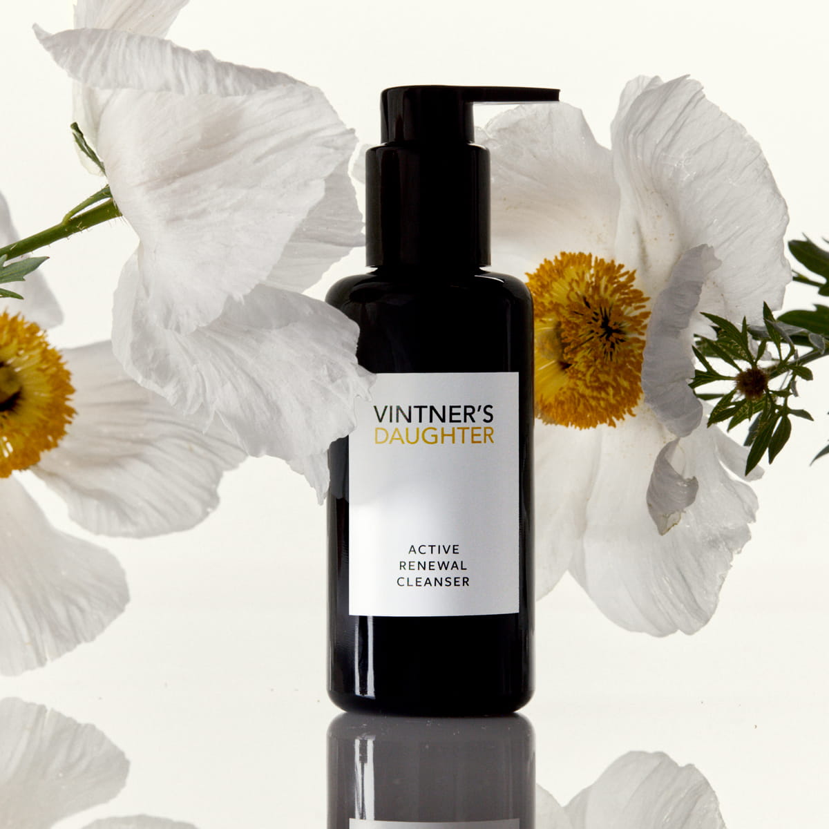 Vintner's Daughter Active Renewal Cleanser (115 ml) - product shown with flowers. 