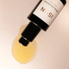 Close up of ISUN Ultra Sunstone Facial Oil (30 ml) showing product swatch