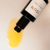 Close up of ISUN Ultra Ruby Facial Oil (30 ml) showing product swatch