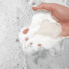 Bathorium Northern Sage Recovery Crush Bath Soak - model holding bath soak in bathtub