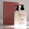 Lifestyle shot of Eau d’Italie Pure Petals Hand & Body Lotion (300 ml) in front of mirror with pink background reflection
