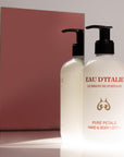 Lifestyle shot of Eau d’Italie Pure Petals Hand & Body Lotion (300 ml) in front of mirror with pink background reflection