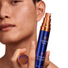 Augustinus Bader The Retinol Serum (30 ml) - model shown holding product and cap