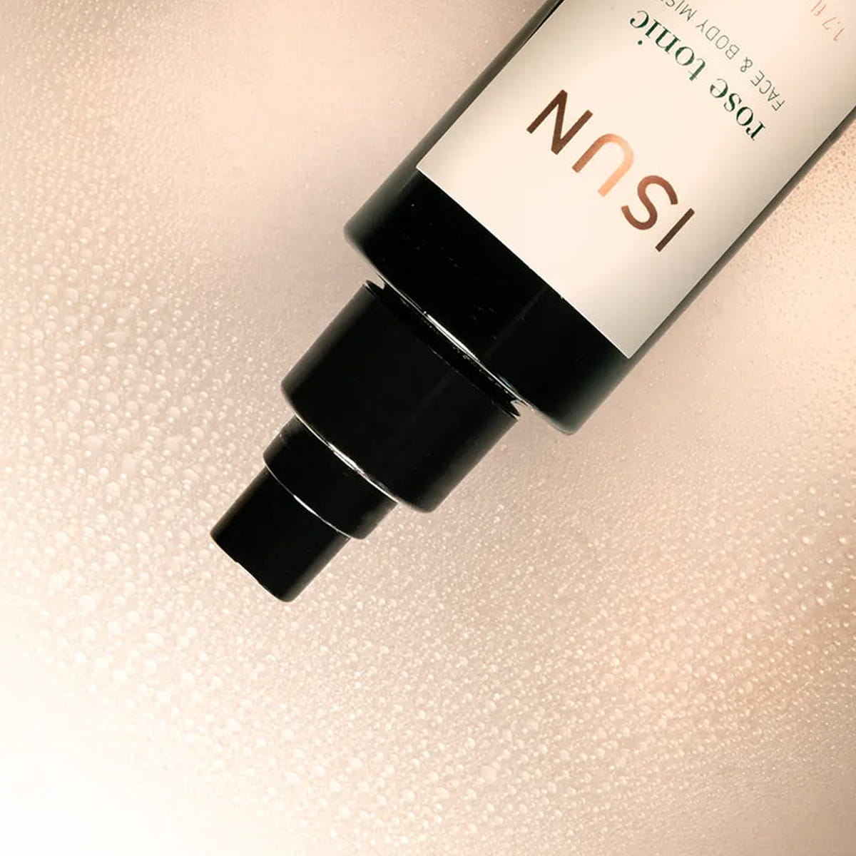 Close up of ISUN Rose Tonic Face & Body Mist (50 ml) showing product swatch