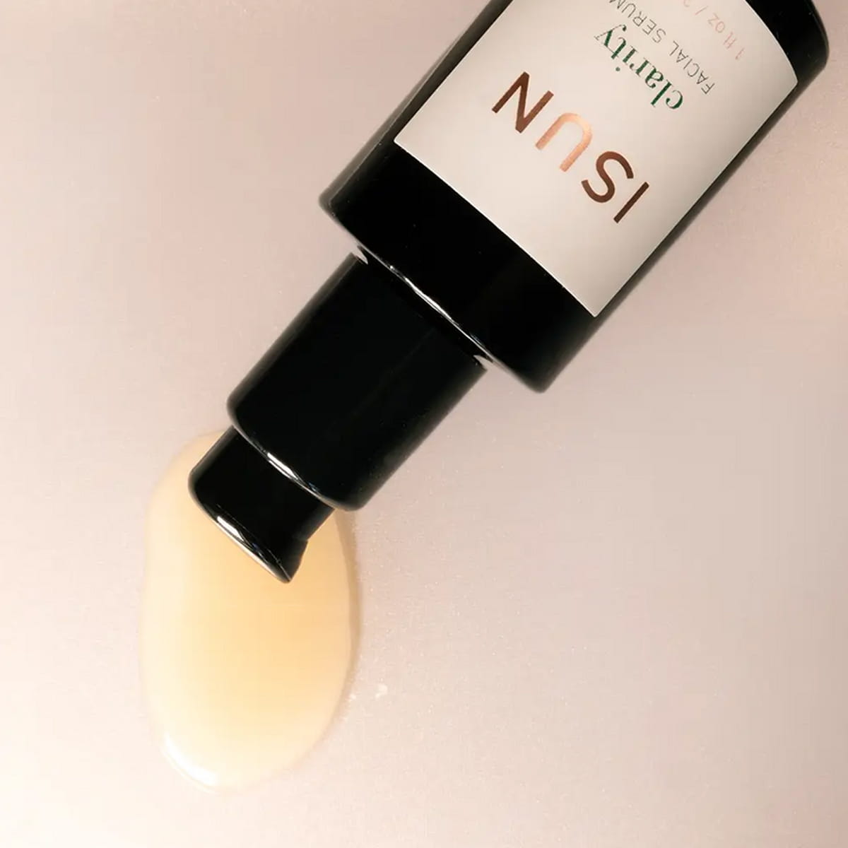 Close up of ISUN Clarity Facial Serum (30 ml) showing product swatch
