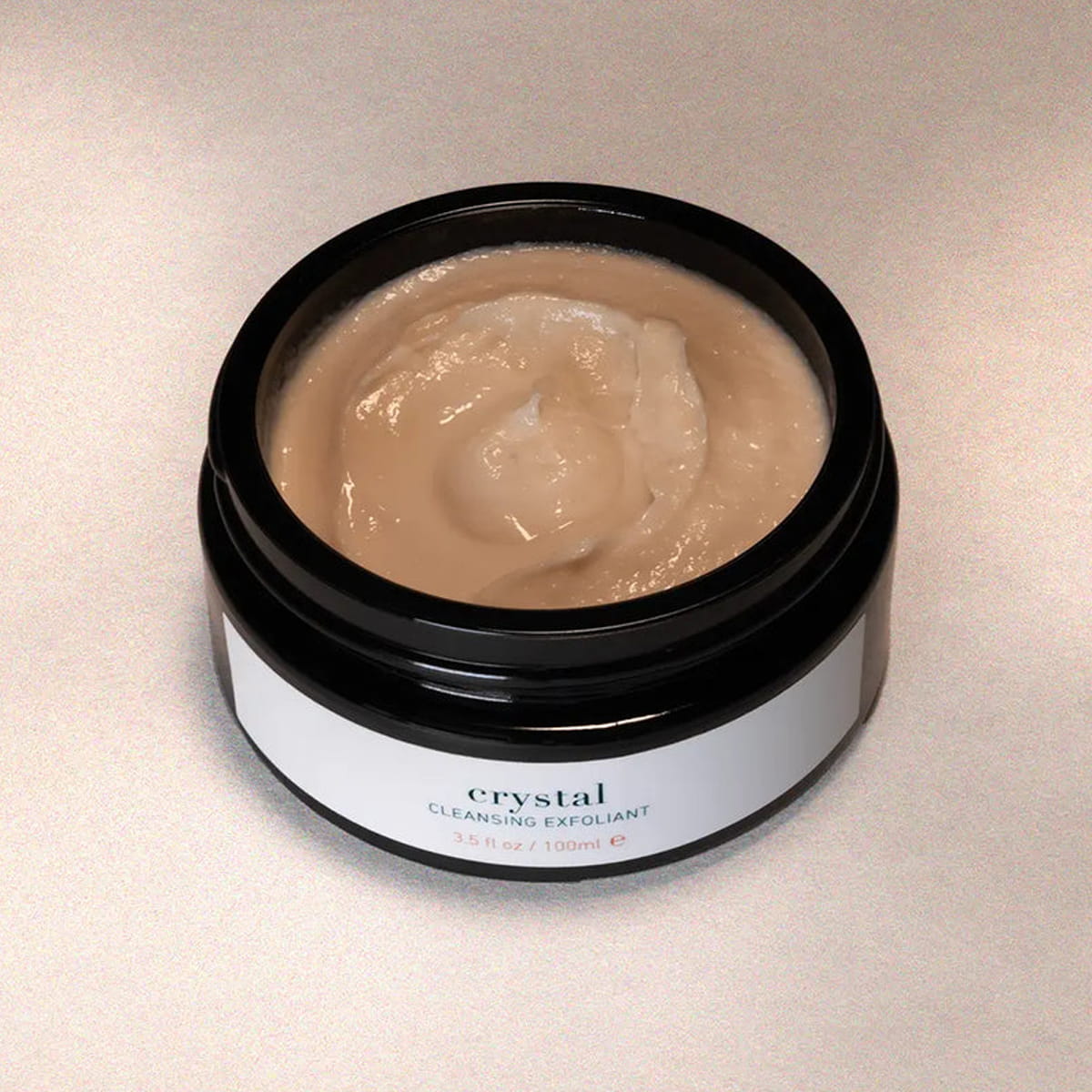 ISUN Crystal Cleansing Exfoliant (100 ml) with lid off to show color and texture of product inside