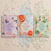 Odacite Soak In Zenitude Bath Soak Trio Set - Products shown with bath soak salts in the background for each variety in the set