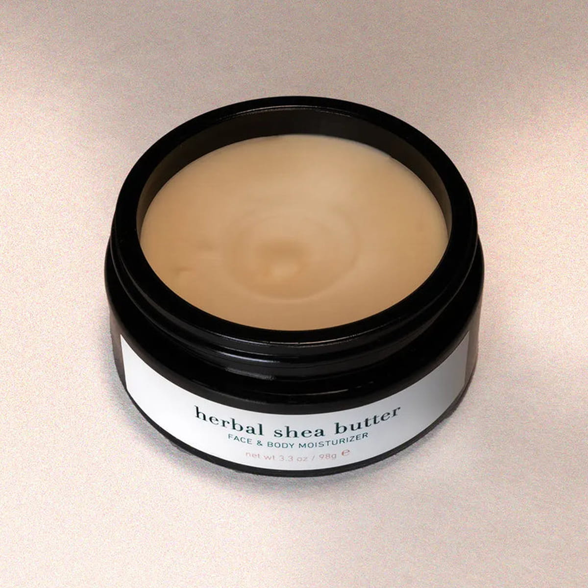 ISUN Herbal Shea Butter Face &amp; Body Moisturizer (98 g) shown without lid to show color and texture of moisturizer inside