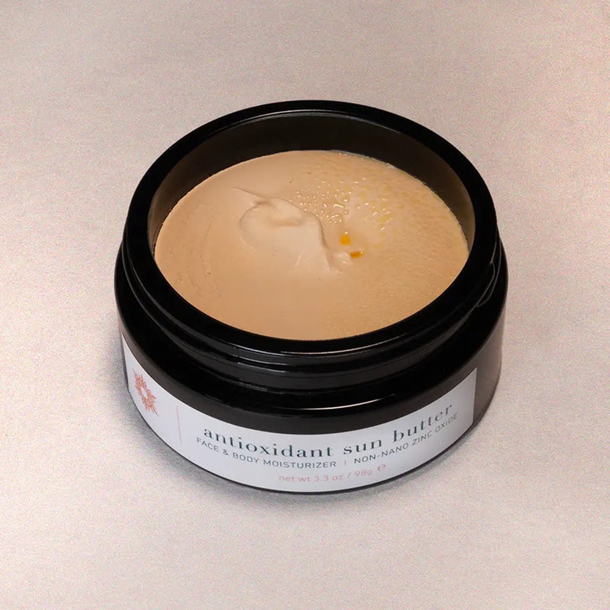 ISUN Antioxidant Sun Butter Face & Body Moisturizer - Non-nano Zinc Oxide (98 g) with lid off showing color and texture of product inside