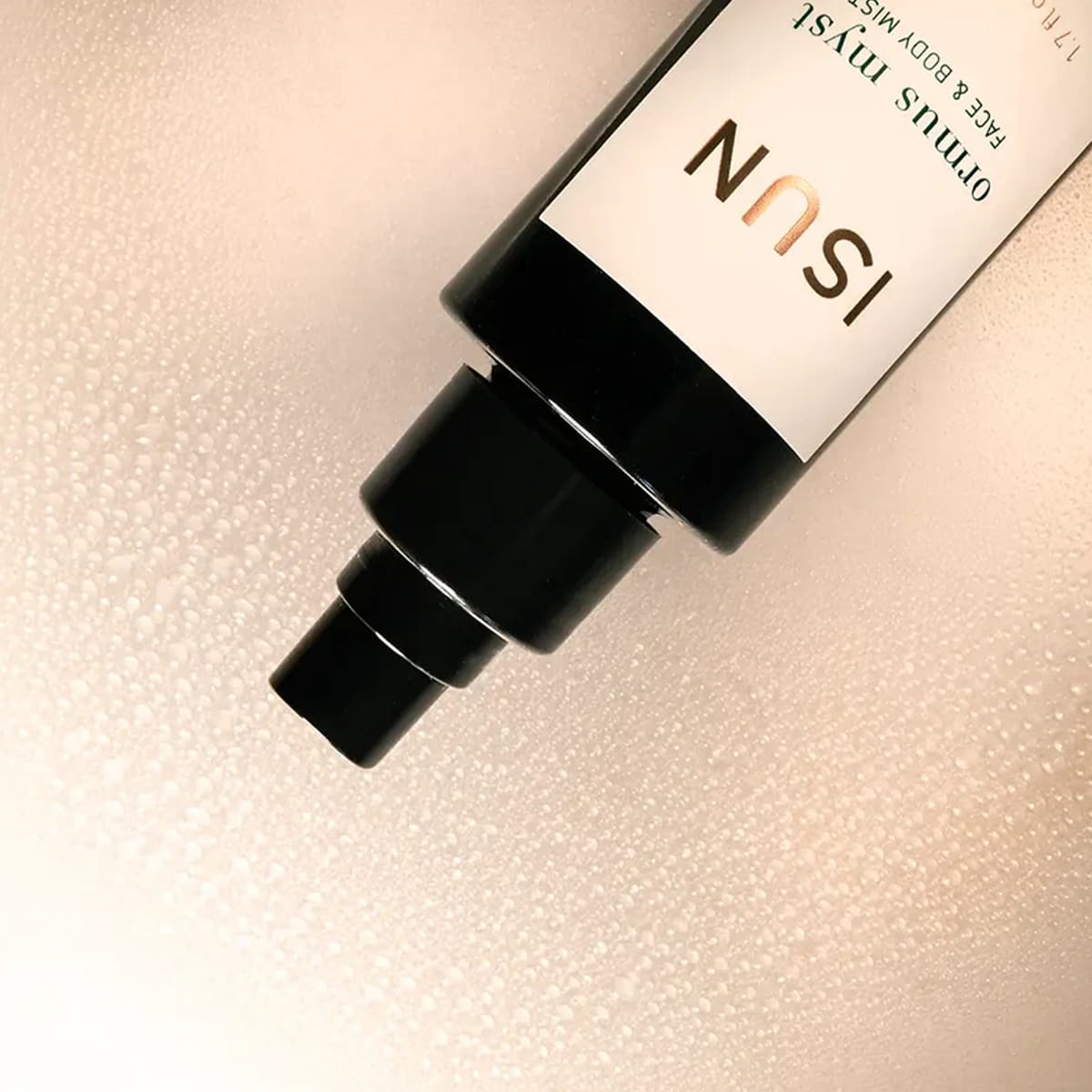 Close up of ISUN Ormus Myst Face &amp; Body Mist (50 ml) showing product swatch