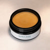 ISUN Golden Balm Face & Body Moisturizer (92 g) shown with lid off and color and texture of moisturizer inside