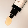 Close up of ISUN Emerald Sun Hydrosol Serum (50 ml) showing product swatch