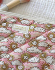 Barnabe Aime Le Cafe Liberty Quilted Beauty Case – Pink Sun - Closeup of product on white quilted background 