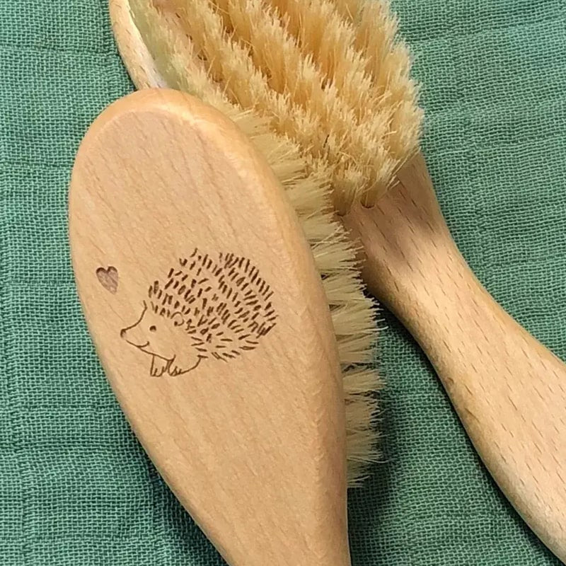 Barnabe Aime Le Cafe Wooden Baby Hair Brush – Hedgehog - Product shown on quilted green background