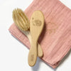 Barnabe Aime Le Cafe Wooden Baby Hair Brush – Hedgehog - Product displayed on pink quilted towel