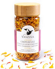 Vanissa “Dusk” Edible Flower Petals: Calendula - Porduct shown with product sprinkled around bottle