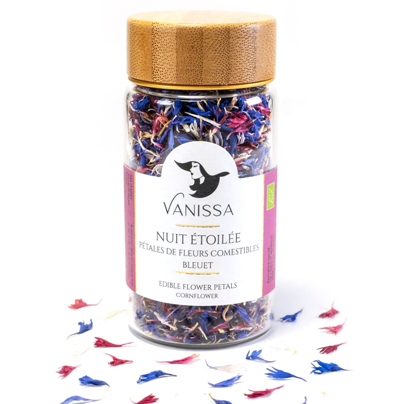 Vanissa “Starry Night” Edible Flower Petals: Cornflower - Product shown sprinkled around bottle.