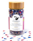Vanissa “Starry Night” Edible Flower Petals: Cornflower - Product shown sprinkled around bottle.